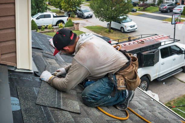Professional Roofing technician working in Mentone, IN